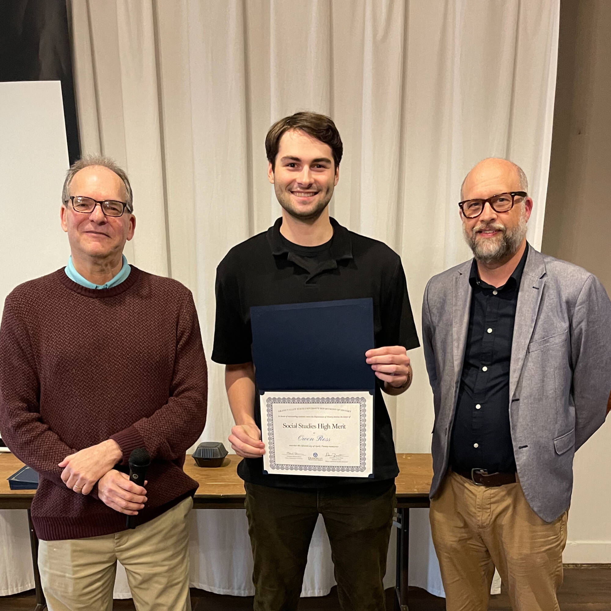 Owen Ross holding award with professors Montagna & Huner